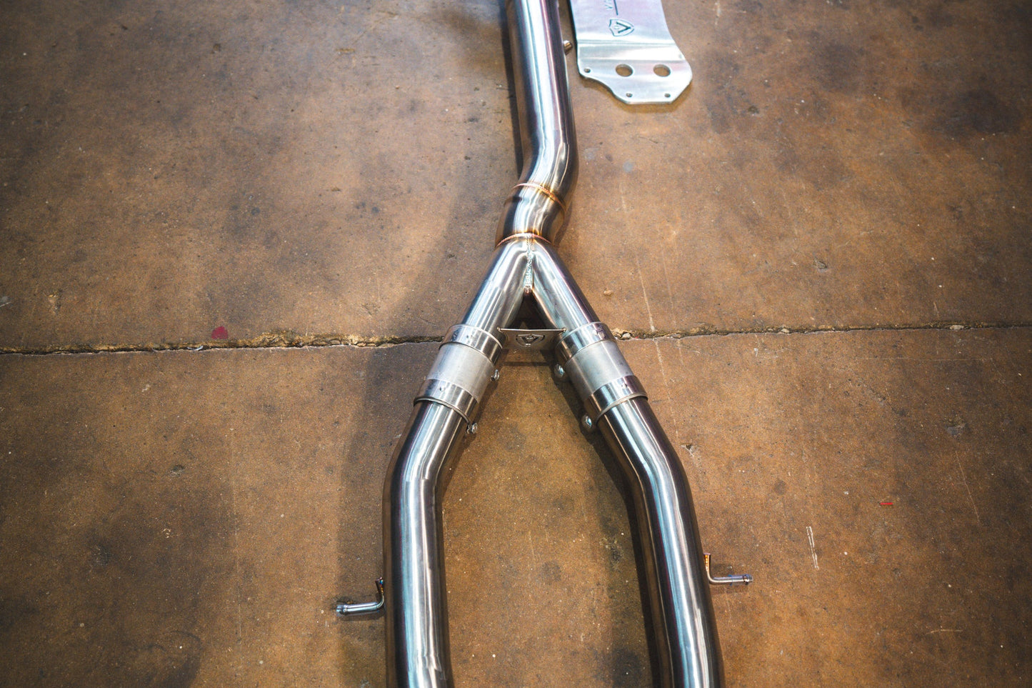 Closeup on the Y Pipe of the Valvetronic BMW G8x M3 / M4 Valved Sport Exhaust System | Insignist Motorsports