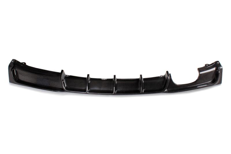 A black carbon fiber diffuser for BMW F30 with a dual exhaust pipe, single outlet design.