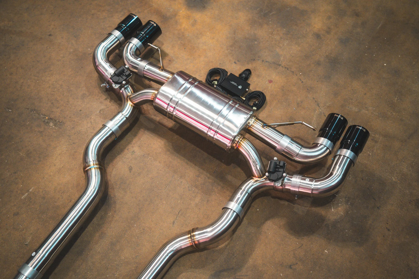 Carbon tips on the Valvetronic BMW G30 M550I Valved Sport Exhaust System in Chrome
