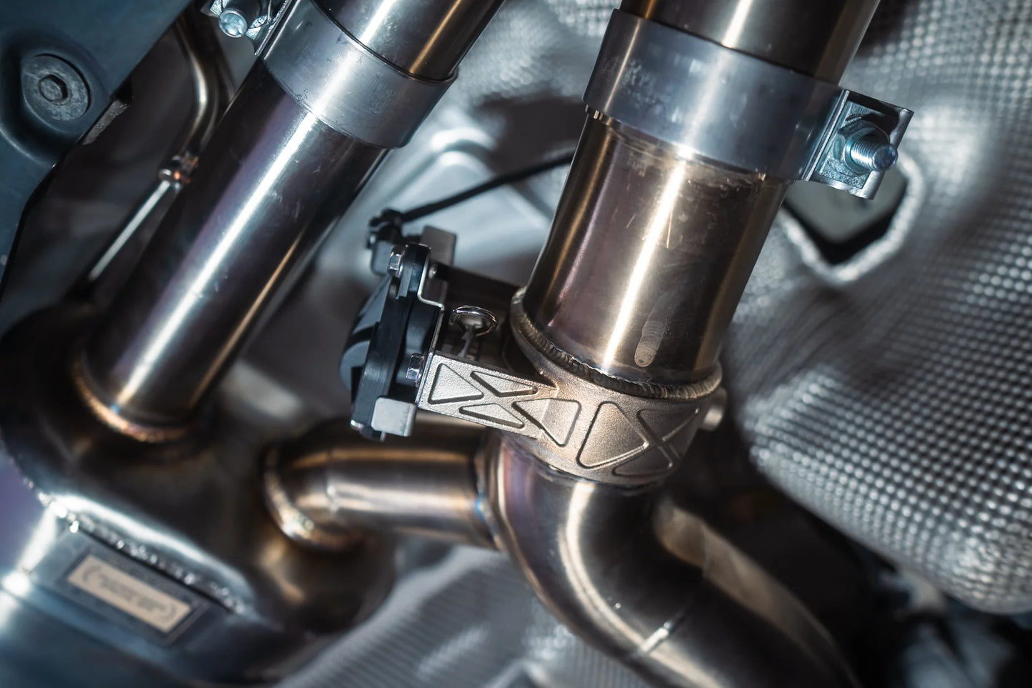 Pipes under the Valvetronic BMW G30 M550I Valved Sport Exhaust System