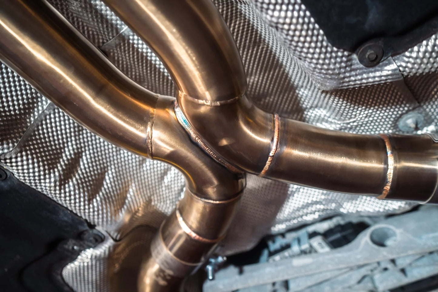 Welding on the titanium for the Valvetronic BMW G30 M550I Valved Sport Exhaust System