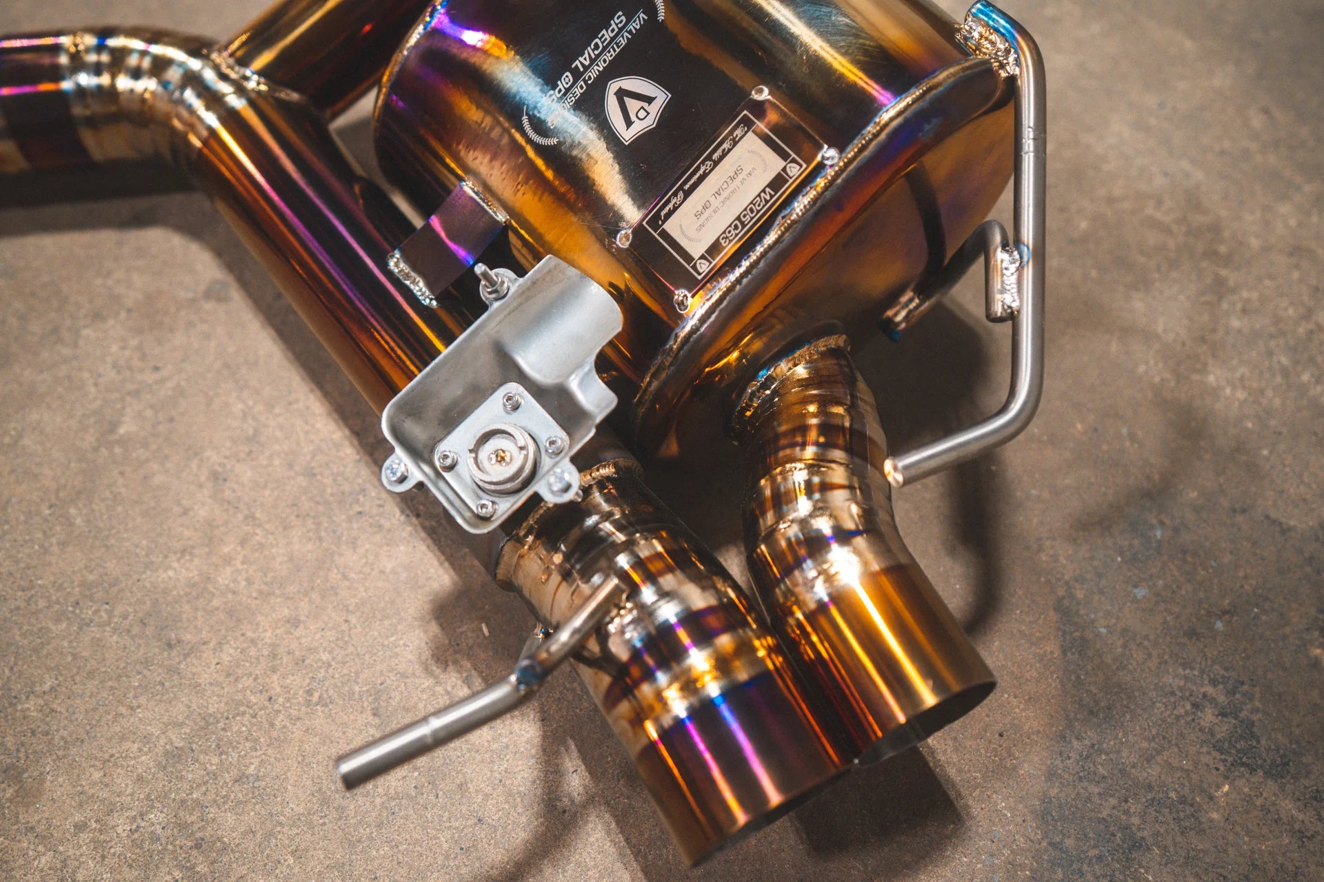 Angled view of the Valvetronic Designs Mercedes W205 C63 / C63S Valved Sport Exhaust System