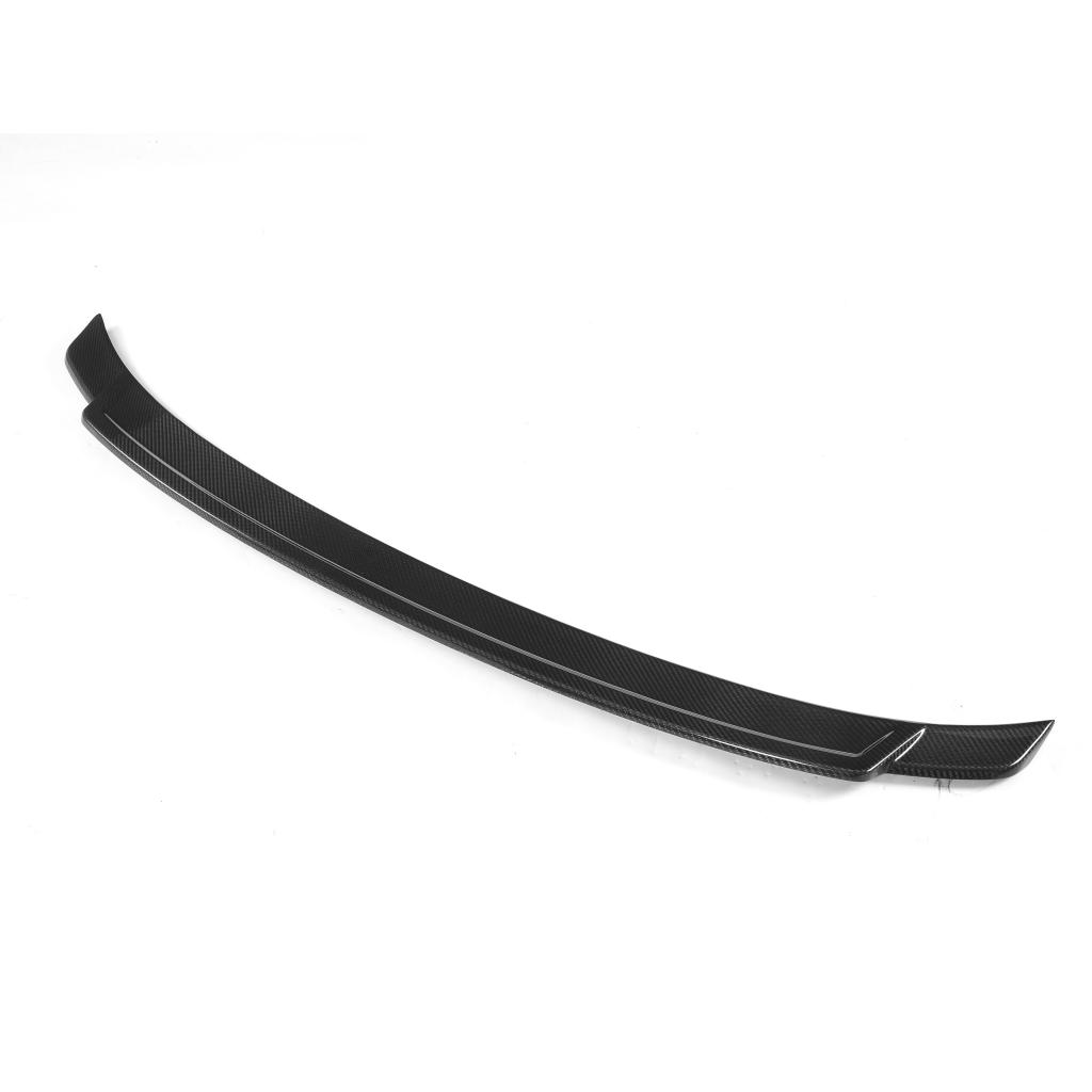 An exotic black carbon fiber trunk spoiler designed for a BMW F32.