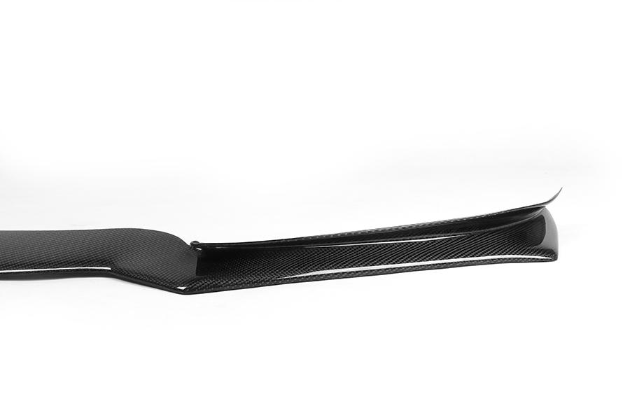 A carbon fiber front lip designed for BMW F32 models, featuring a glossy black finish.