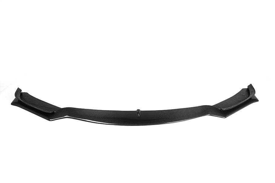 A carbon fiber front lip designed for BMW F32 models, featuring a glossy black finish.
