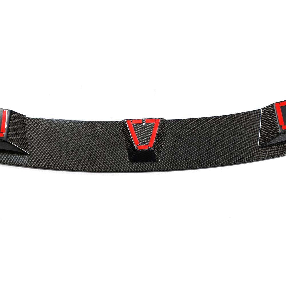 A carbon fiber front lip designed for BMW F32, featuring a black weave pattern with red accents along the lower edge.