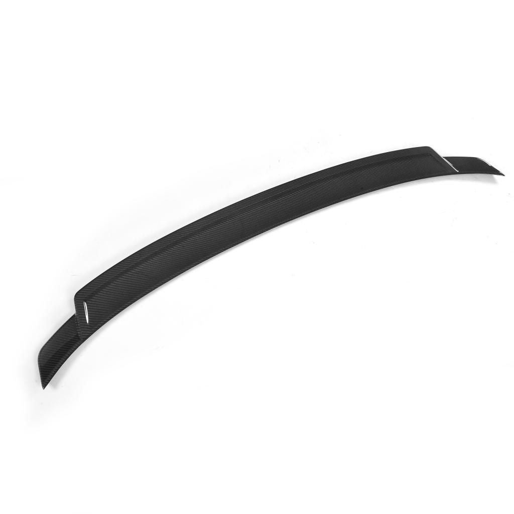 An exotic black carbon fiber trunk spoiler designed for a BMW F32.