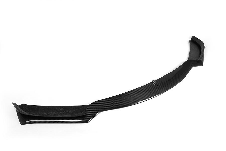 A carbon fiber front lip designed for BMW F32 models, featuring a glossy black finish.