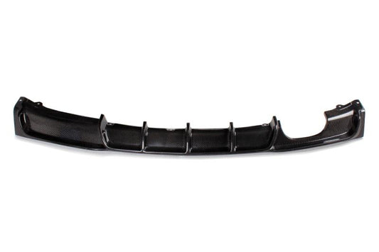 A black carbon fiber diffuser for BMW F30 with a dual exhaust pipe, single outlet design.