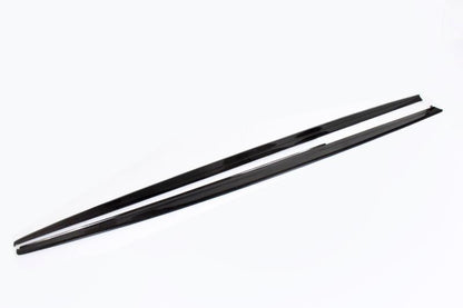 A pair of carbon fiber side skirts for BMW F30 designed to complement the vehicle's aesthetics and improve aerodynamics.
