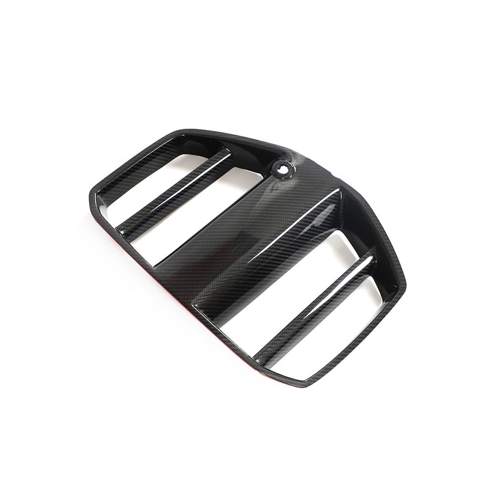 One side of the GT Style Dry Carbon Fiber Front Kidney Grille for BMW G80/G82