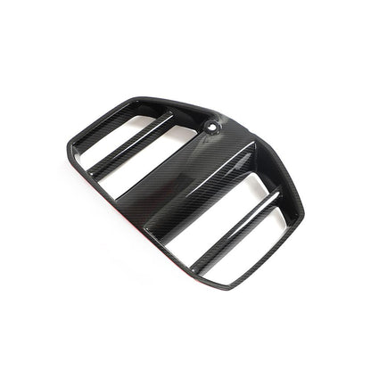 One side of the GT Style Dry Carbon Fiber Front Kidney Grille for BMW G80/G82