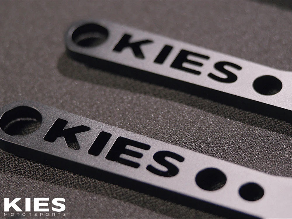 Logo on the KIES Executive Line G8x S58 Carbon Fiber Strut Brace | G80, G81 M3, G82, G83 M4, G87 M2