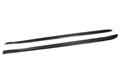 A pair of carbon fiber side skirts designed for the BMW F32, presented on a white background.