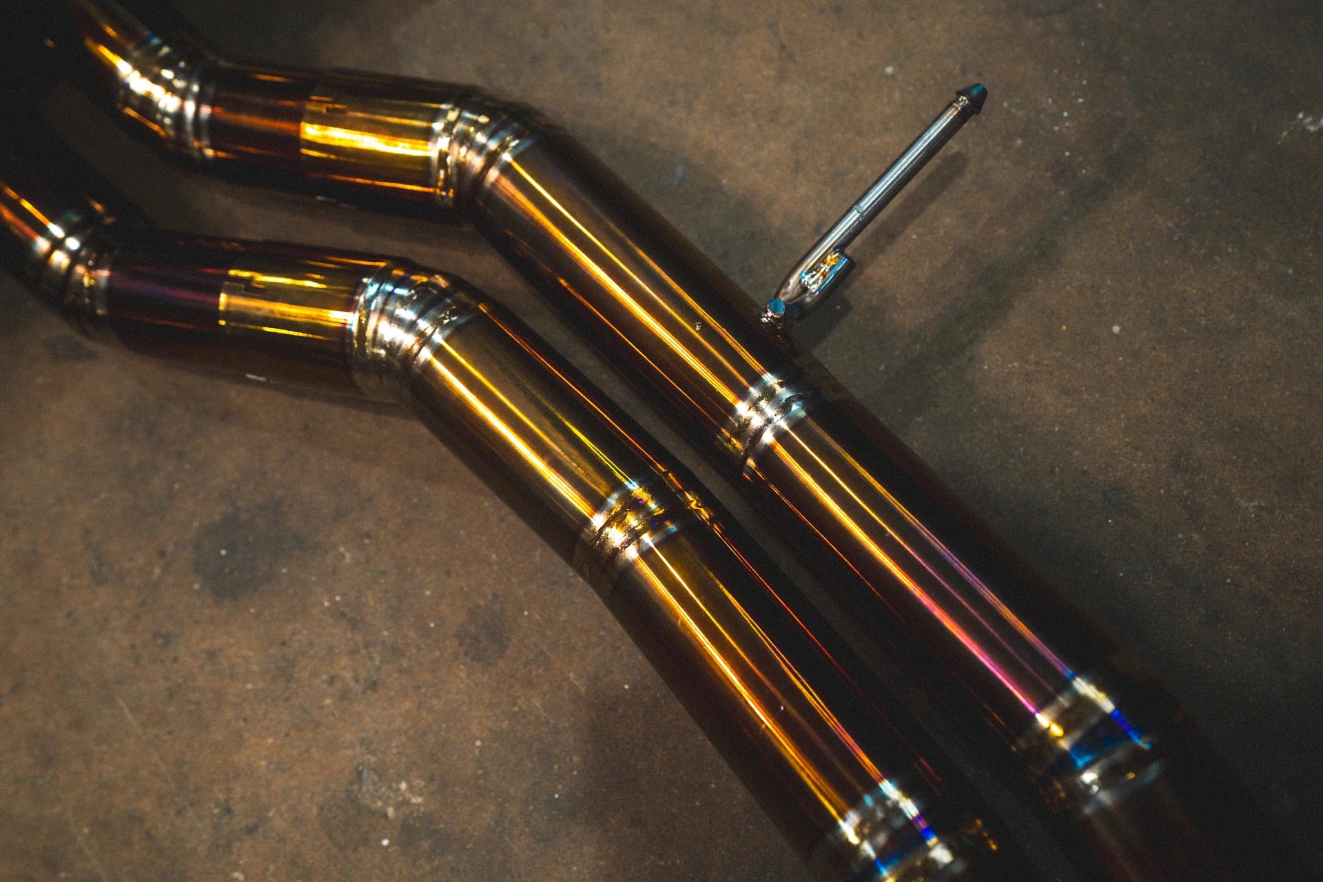 Pipes on the Valvetronic Lamborghini Urus Valved Sport Exhaust System in Titanium