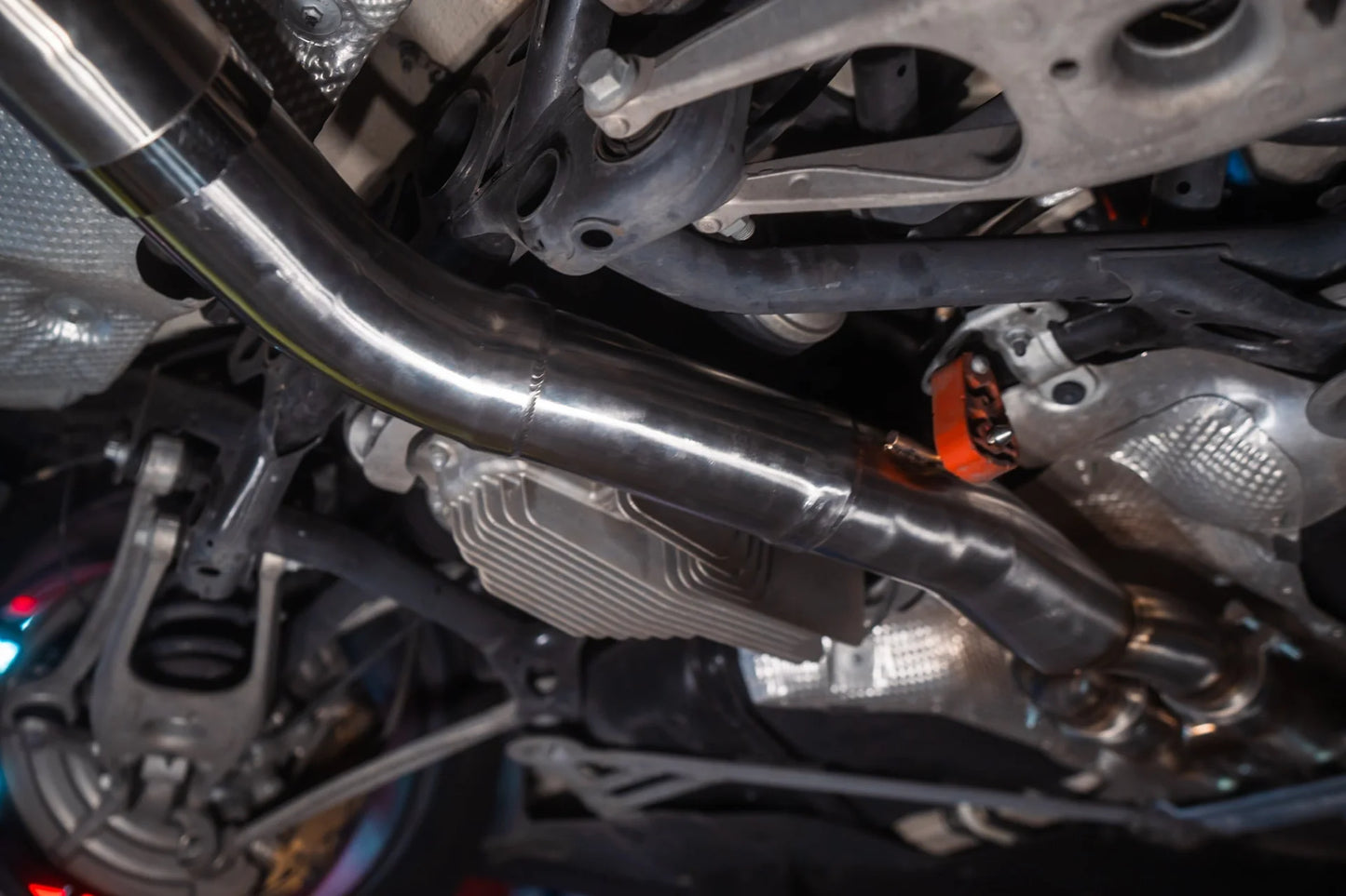 Closeup of the pipe installed for the Valvetronic BMW F8x M3 / M4 Equal Length Valved Sport Exhaust System | Insignist Motorsports