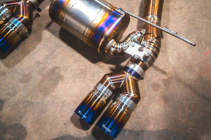 Angled view on the titanium tips for the Valvetronic BMW F8x M3 / M4 Equal Length Valved Sport Exhaust System | Insignist Motorsports