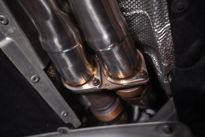 Underpipe view of the Valvetronic BMW F8x M3 / M4 Equal Length Valved Sport Exhaust System | Insignist Motorsports in chrome 