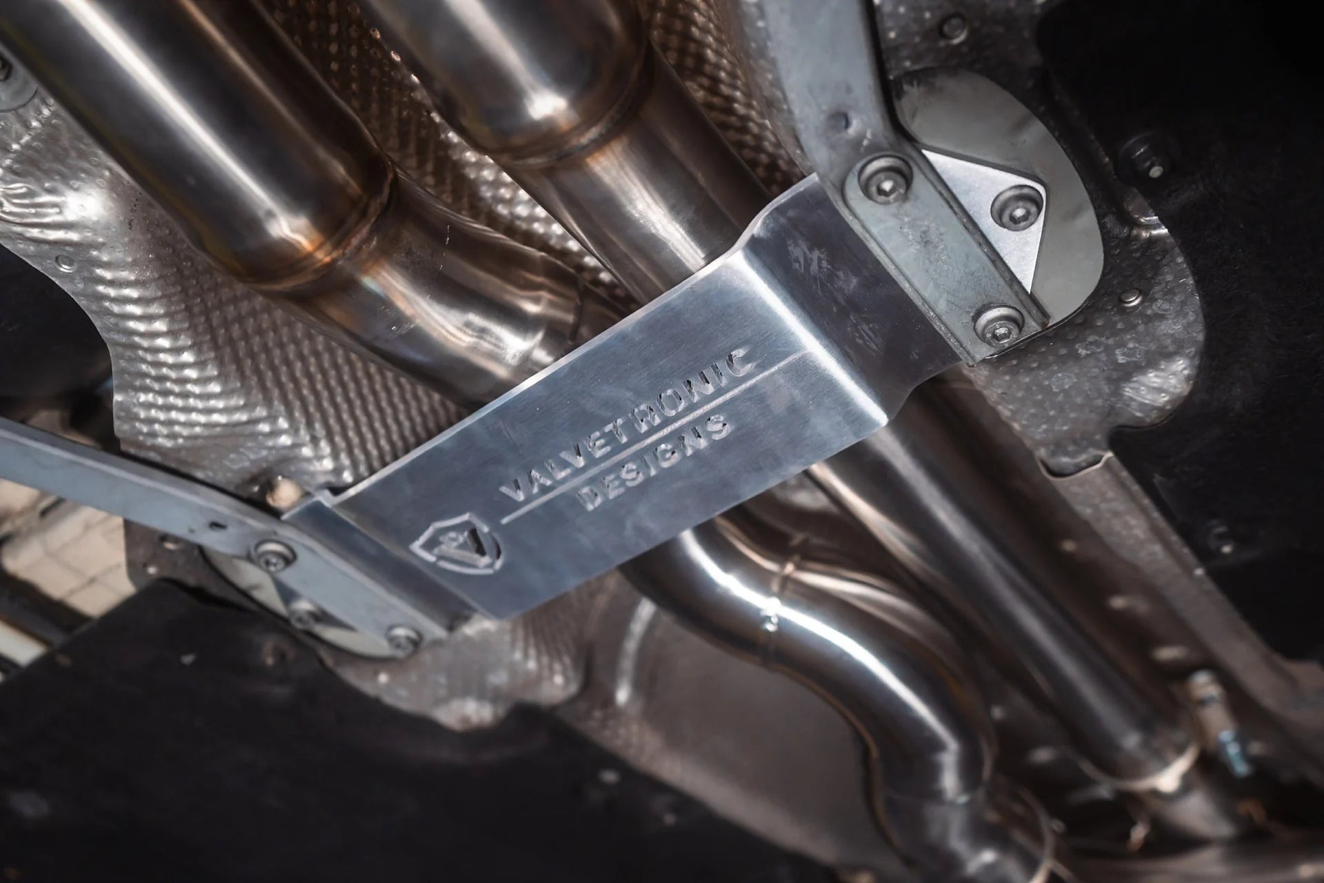 Label on the Valvetronic BMW F8x M3 / M4 Equal Length Valved Sport Exhaust System | Insignist Motorsports Undercarriage 