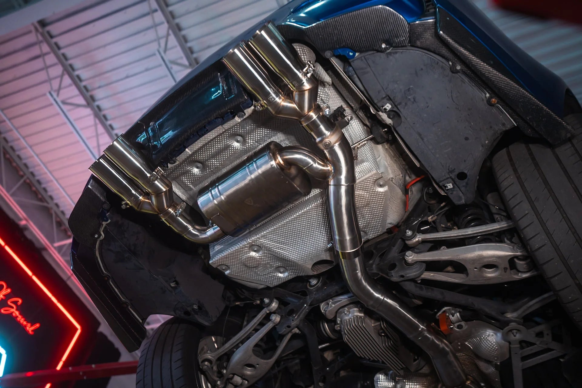 Undercarriage view on the Valvetronic BMW F8x M3 / M4 Equal Length Valved Sport Exhaust System | Insignist Motorsports in Chrome 