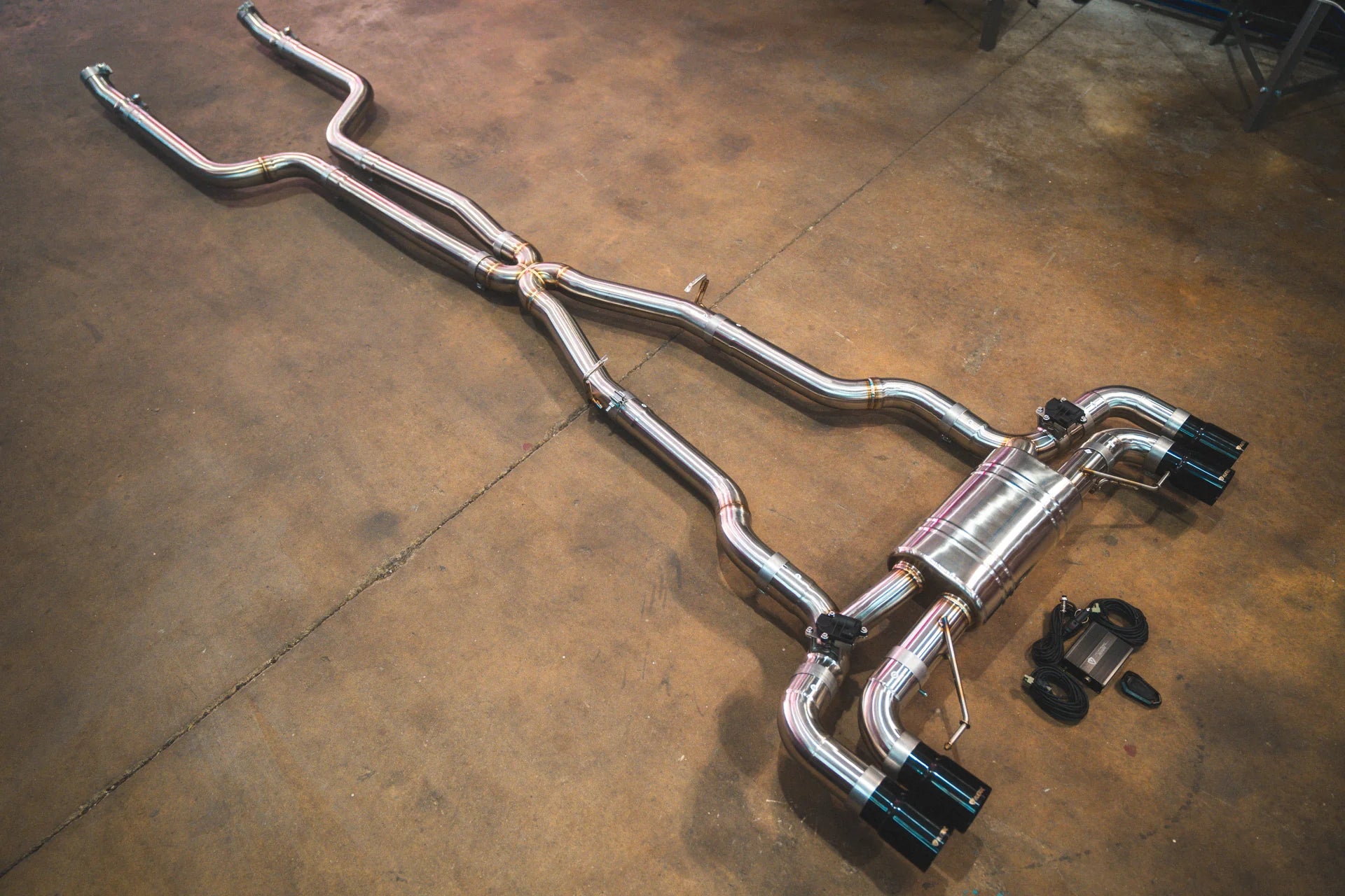 Angled chrome view of the Valvetronic BMW G30 M550I Valved Sport Exhaust System