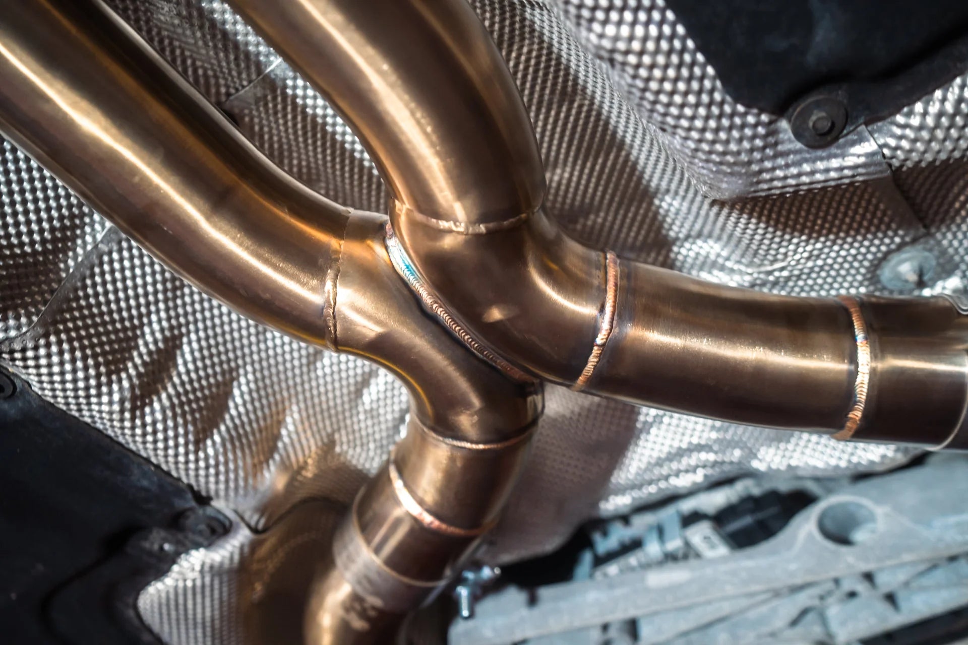 Welding on the titanium for the Valvetronic BMW G30 M550I Valved Sport Exhaust System