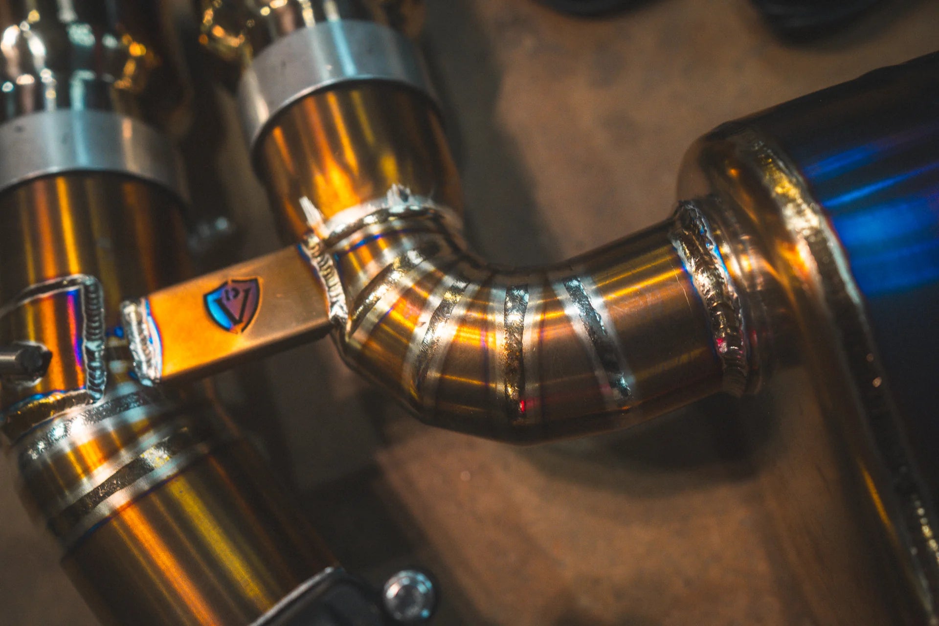 Another angled view for the Valvetronic BMW G8x M3 / M4 Valved Sport Exhaust System | Insignist Motorsports in titanium 