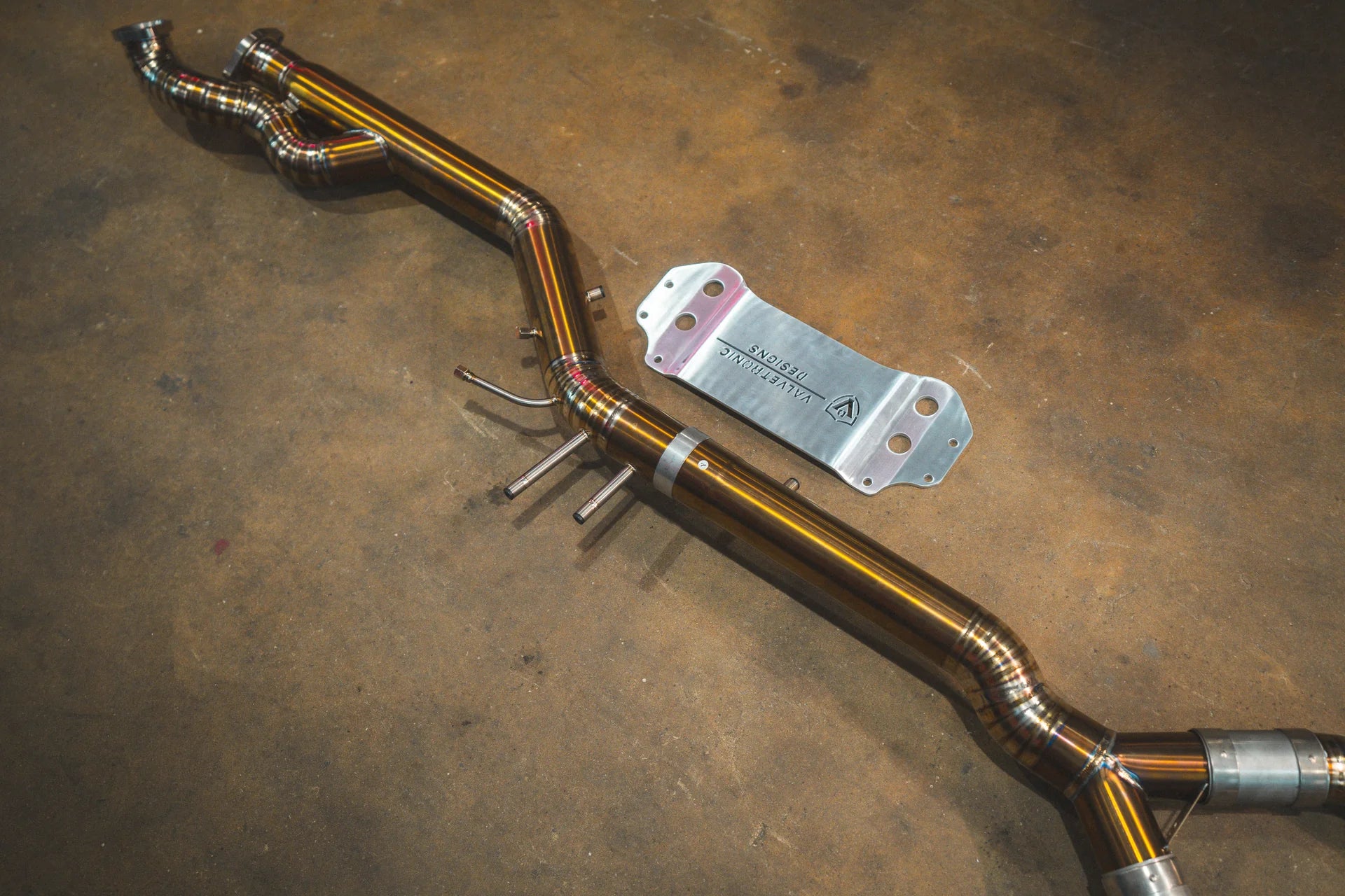 End Pipe view of the y pipe in titanium for the Valvetronic BMW G8x M3 / M4 Valved Sport Exhaust System | Insignist Motorsports