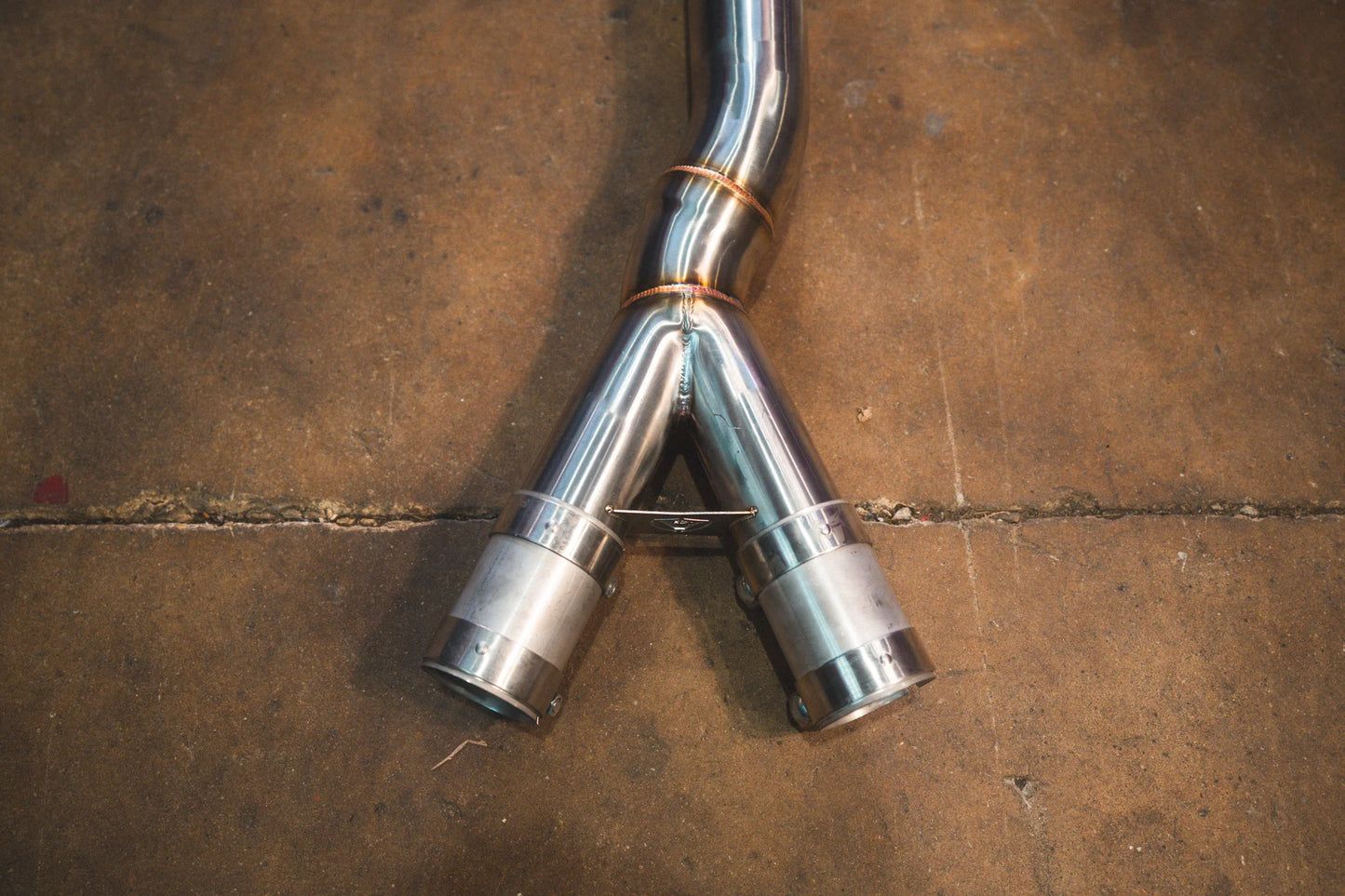 Closeup on the Y end of the Valvetronic BMW G8x M3 / M4 Valved Sport Exhaust System | Insignist Motorsports