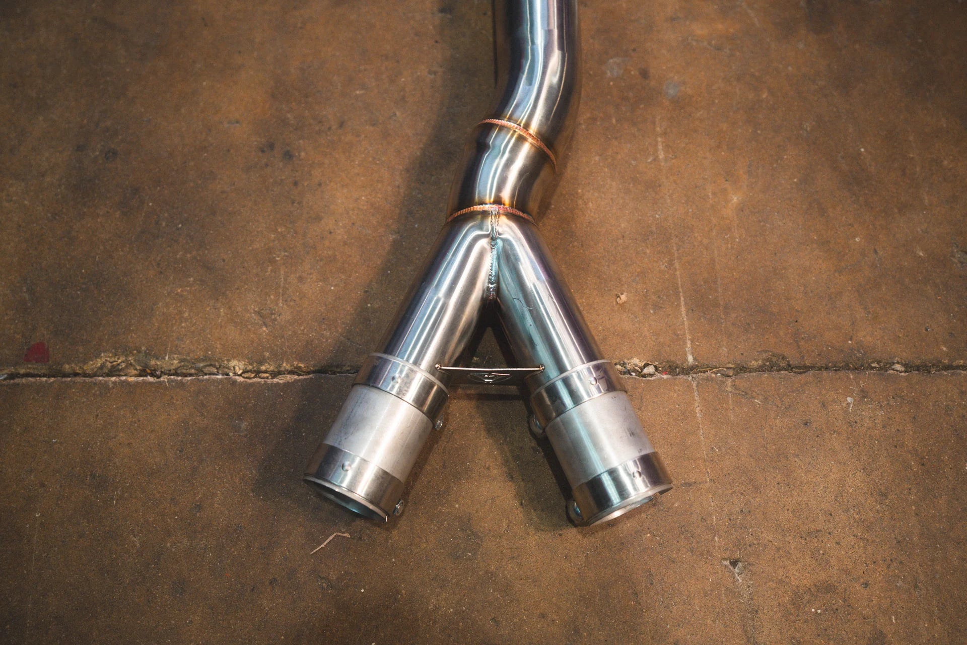 Closeup on the Y end of the Valvetronic BMW G8x M3 / M4 Valved Sport Exhaust System | Insignist Motorsports