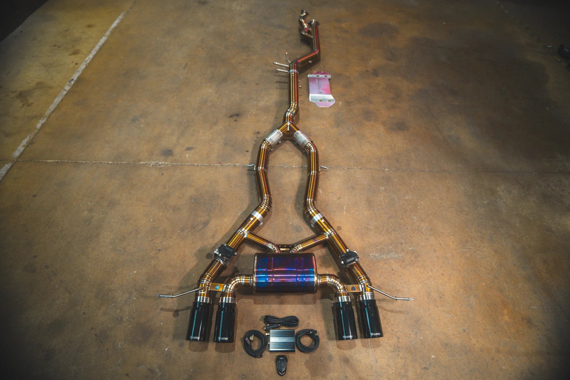 Black tips full view on the Valvetronic BMW G8x M3 / M4 Valved Sport Exhaust System | Insignist Motorsports in titanium 
