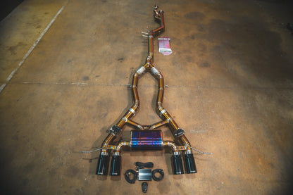 Black tips full view on the Valvetronic BMW G8x M3 / M4 Valved Sport Exhaust System | Insignist Motorsports in titanium 