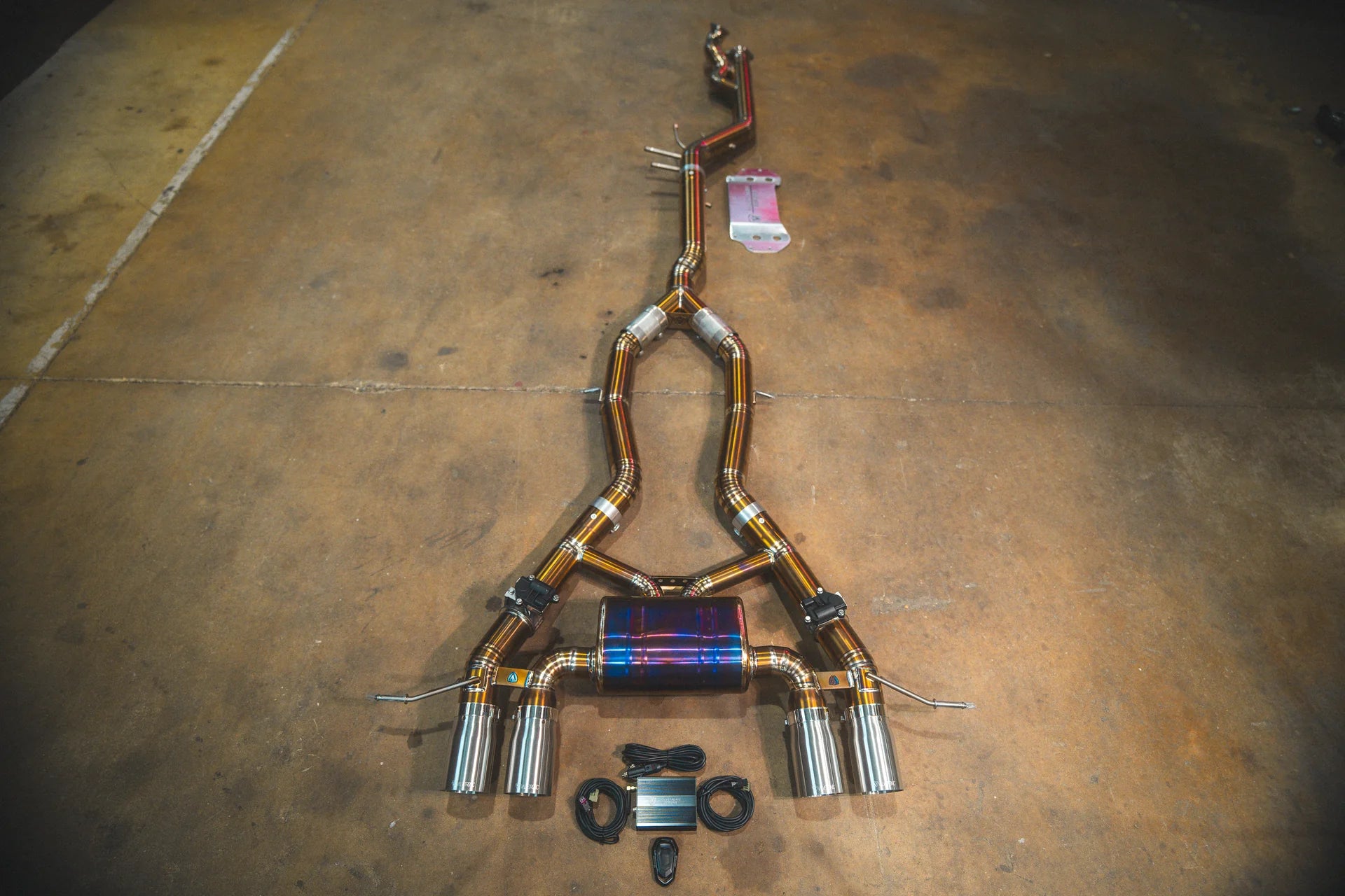Full view of the Valvetronic BMW G8x M3 / M4 Valved Sport Exhaust System | Insignist Motorsports with chrome tips with the titanium choice