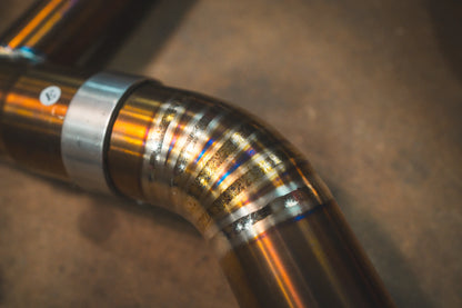 Closeup of the titanium pipe on the Valvetronic BMW G8x M3 / M4 Valved Sport Exhaust System | Insignist Motorsports