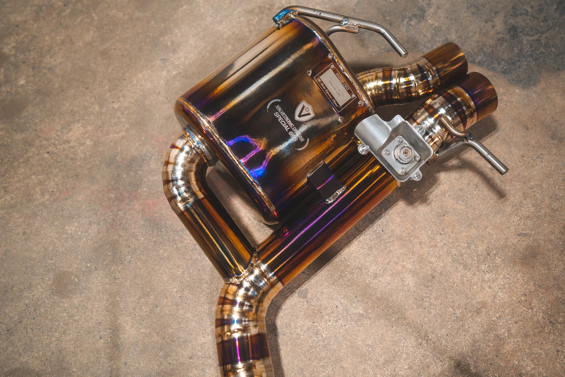 The logo on the Valvetronic Designs Mercedes W205 C63 / C63S Valved Sport Exhaust System 
