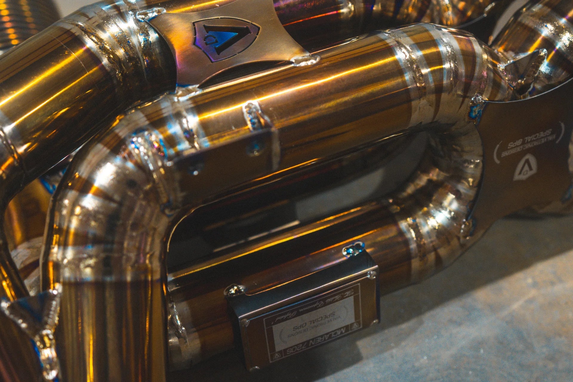 Logos on the Valvetronic Mclaren 720S Valved Sport Exhaust System