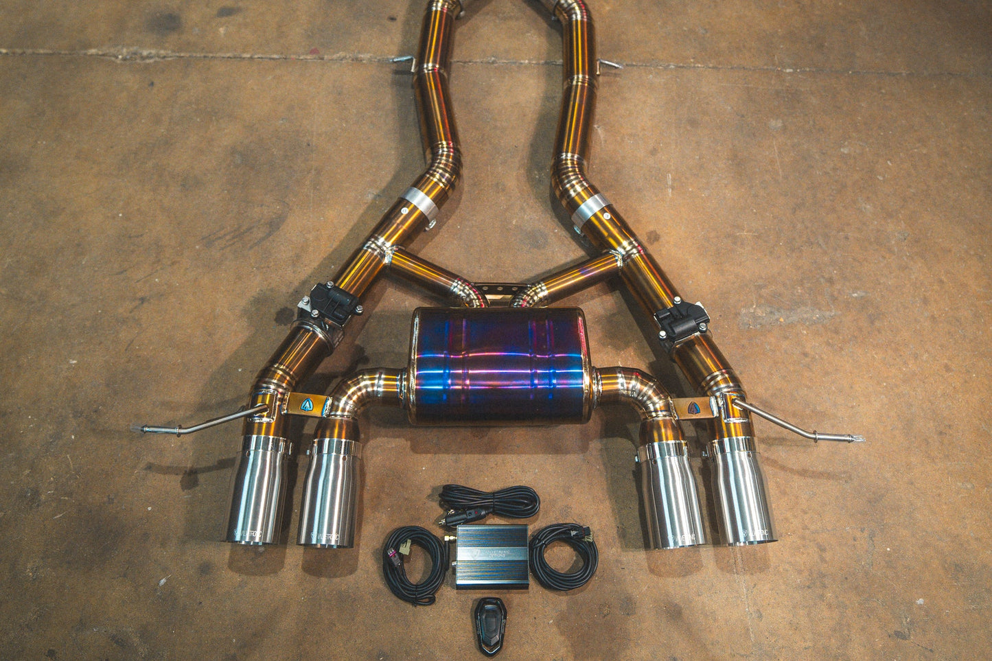 Chrome tips on the titanium Valvetronic BMW G8x M3 / M4 Valved Sport Exhaust System | Insignist Motorsports