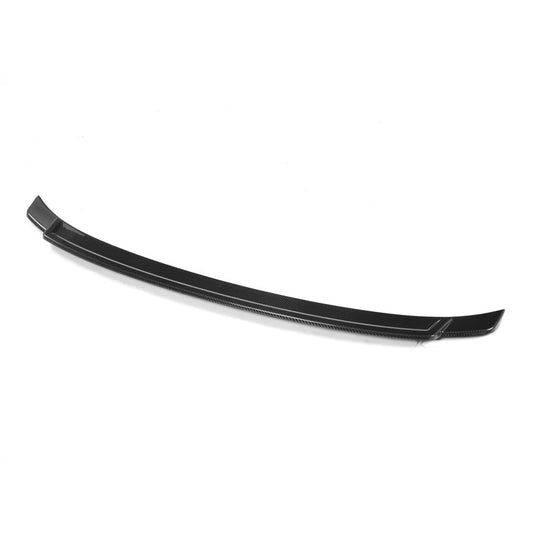 An exotic black carbon fiber trunk spoiler designed for a BMW F32.
