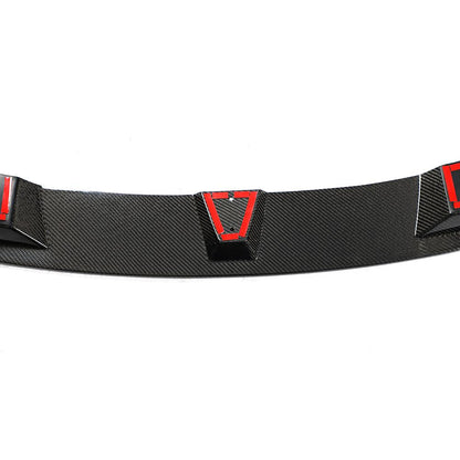 A carbon fiber front lip designed for BMW F32, featuring a black weave pattern with red accents along the lower edge.